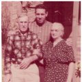 John L. Daniel and wife, Nellie Myers Daniel, with grandson, Billy, standing in rear