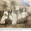 Rebecca Myrtle Moore Davis holding Lena Davis, Alta Mai Davis standing beside William Carroll Davis, Pauline Davis sitting on leg of William Carroll Davis, Thena Trusty Davis, Bessie Oakley Davis and Nettie J. Herndon Davis holding twins, Minnie John Davis and William Thomas Davis, then standing are William "Billy" Parker, Lura Davis Parker, Arch Davis with Lucille Davis, Talmage Davis holding Wilma Davis, Robert "Bob" Davis