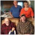 L.C. Tramel holding Amelia Vaughn, Drake Vaughn, Larry Tramel, and Natasha Tramel Vaughn